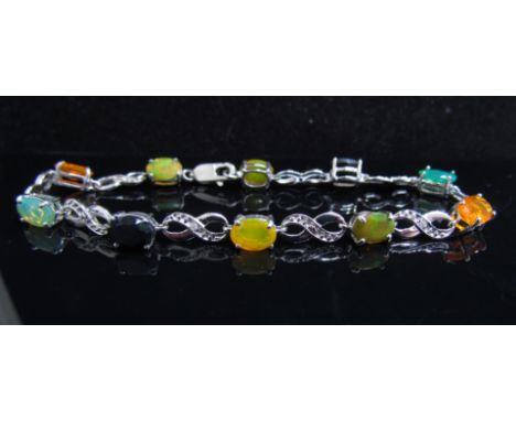 A multi coloured opal and diamond bracelet, clasp stamped 925, 19cm long, with certificate