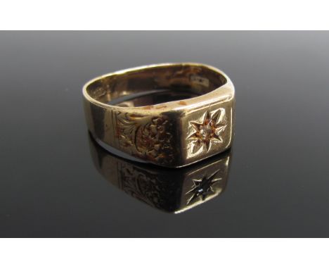 A 9ct gold signet ring with engraved shoulders and diamond to centre in star setting, re-sized, miss-shaped. Size V, 6g