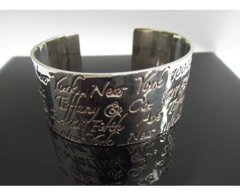 A Tiffany &amp; Co sterling silver wide cuff bangle with fifth avenue New York inscriptions, 53g