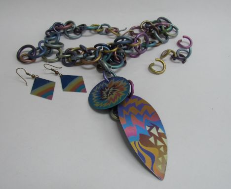 A modernist design contemporary titanium link necklace of multi colours and a similar pair of earrings   