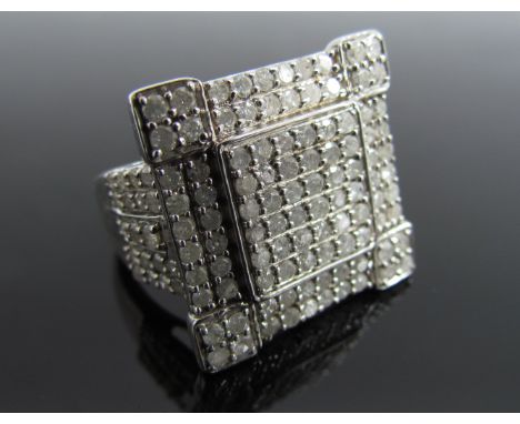 A diamond chip dress ring in square mount, shank stamped 925. Size Q, 8.1g