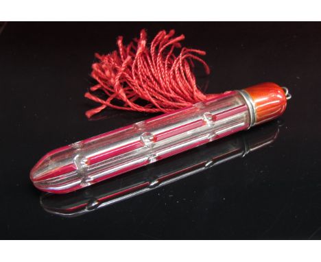 A cut glass and enamel scent bottle with tassel end, 8cm long