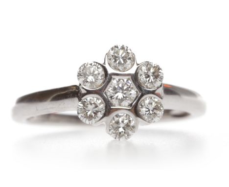 EIGHTEEN CARAT WHITE GOLD DIAMOND CLUSTER RINGthe snowflake bezel set with round diamonds totalling approximately 0.30 carats
