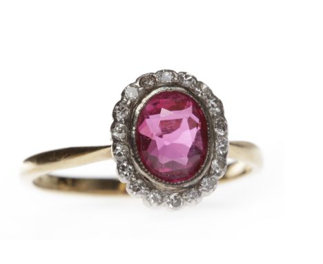 CREATED RUBY AND DIAMOND RINGset with a central oval created ruby 7.4x5.8mm surrounded by single cut diamonds, hallmarks worn