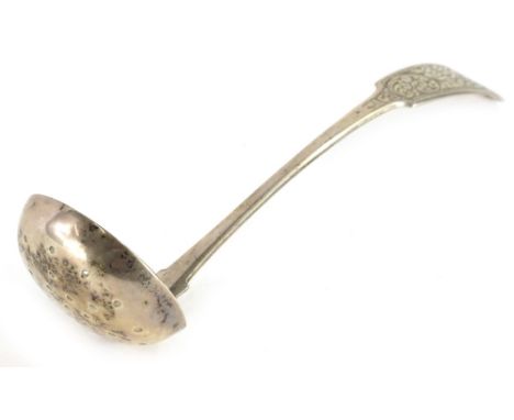 An early 19thC Scottish provincial fiddle pattern toddy ladle, engraved with scrolls, makers stamp R &amp; RK, hallmarked for