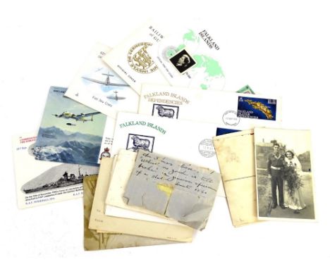 A collection of postcards, first day covers, etc.