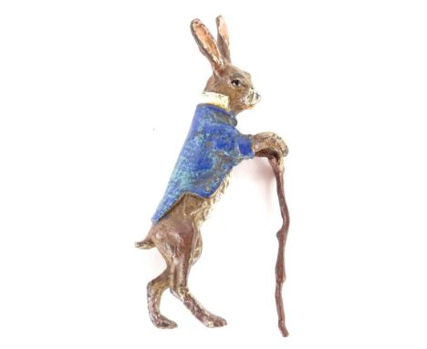 A cold painted model of a Beatrix Potter type rabbit with a walking stick, Bergman mark underneath, 8cm H.