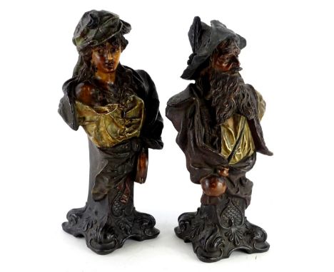 A pair of late 19thC Austrian cold painted terracotta busts, modelled in the form of a pirate type figure and a female gypsy,