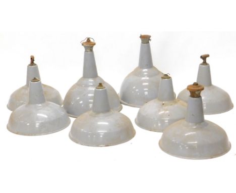 A collection of eight similar grey enamel industrial light fittings, and a wall light fitting. (9)