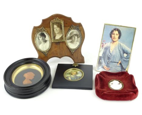 A collection of portraits, to include a wax portrait of a young girl in ebonised frame, a triple Edwardian frame containing t