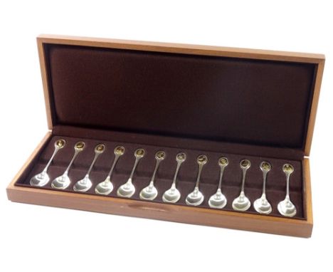 A set of twelve silver RSPB commemorative teaspoons, London 1975, with certificate information r regarding the birds, fitted 