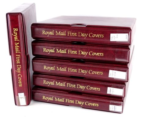 A box containing six albums of first day covers.