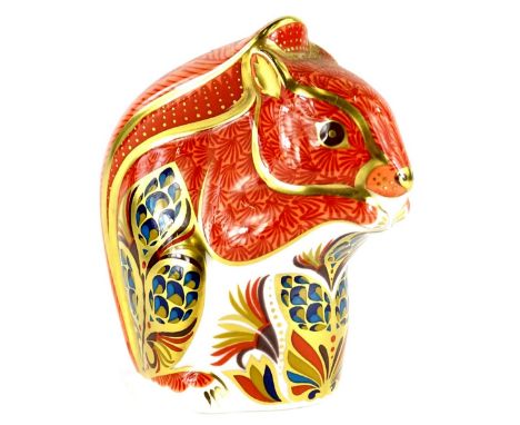 A Royal Crown Derby porcelain paperweight, modelled in the form of a red squirrel, gold button to underside.