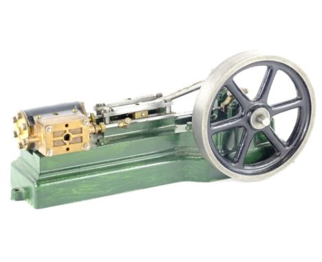 A small Stuart part steam engine, stamped.