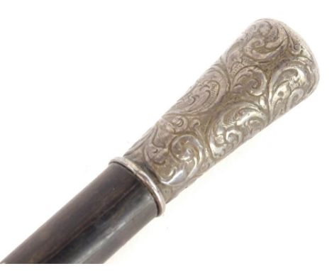 An ebonised walking cane or long swagger stick, with silver handle, marks indistinct.