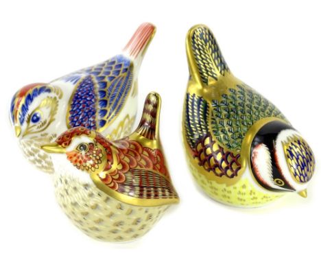 Three small Royal Crown Derby porcelain bird paperweights, each with a gold button, to include The Jenny Wren.