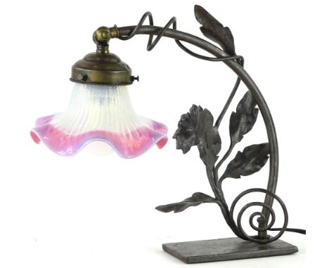 A French bronzed metal lamp base, stamped F Arion, with mottled purple, pink and white shade.