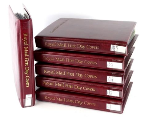 A box containing six albums of first day covers.