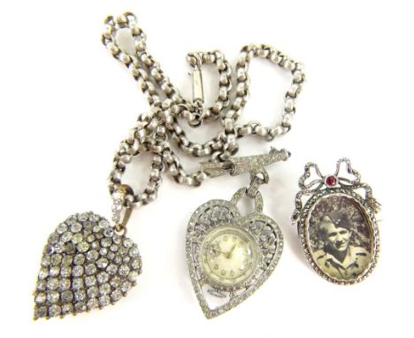 Three items of Victorian and later jewellery, comprising a Victorian portrait brooch, with marcasite border and red paste sto