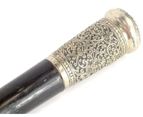 A small Indian ebony and white metal mounted swagger stick, with repousse decoration of scrolls, etc., 53cm L.