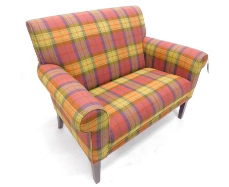 A two seat sofa, upholstered in Dorma  pink, purple, yellow and green Berwick pattern tartan fabric, on square tapering legs,