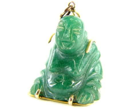 A carved jade Buddha pendant, with yellow metal wire frame, with Chinese writing to the rear, stamped 14k, 2.5cm H, 7.9g all 