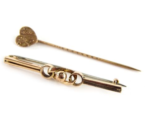 A 9ct gold bar brooch and stick pin, comprising a gold lapel pin with heart shaped top, and a central twist design bar brooch