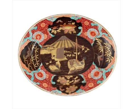 COLOURED ARITA OVAL DISH MEIJI PERIOD sitting on a ring base, the borders with foliate designs vibrantly painted in a charact