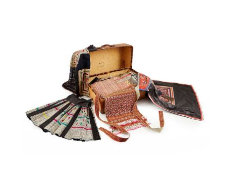 COLLECTION OF MIAO ETHNIC COSTUMES 20TH CENTURY comprising: a batik cross-stitch embroidered blouse (130cm across sleeves, 80