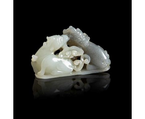 PALE CELADON ’DEER WITH LINGZHI' JADE QING DYNASTY, 19TH CENTURY of slightly curved triangular shaped, worked cleverly with a