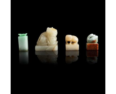 GROUP OF FOUR JADE SEALS comprising: a jadeite square seal with a bat finial, the stone of mixture pale and brigh green tone;
