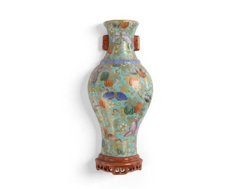 FAMILLE ROSE WALL VASE QIANLONG MARK the domed side of the vase form decorated with butterflies in flight amidst melons and f