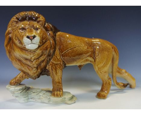A substantial Goebel lion stood on a rocky outcrop, impressed 36 019 25 to base 