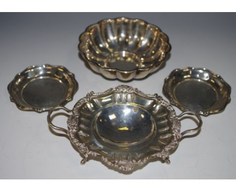 A Spanish silver twin handled dish, leafy scroll with intermitted crown border by The Pasgorcy Silversmiths, Madrid; a pair o