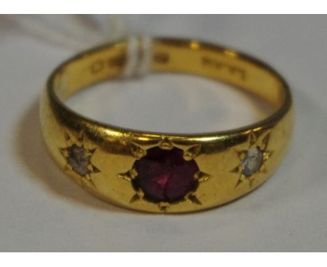 A lady's 22ct gold ring set with diamonds and a ruby (5.1g)