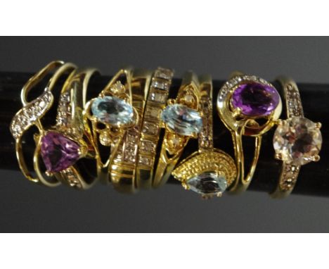 A 9ct gold half eternity diamond chip ring; a 9ct gold ring set with pear shaped aquamarine; a 9ct gold ring set with an oval