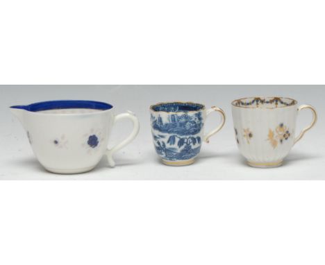 A Caughley Bute shaped cream jug, the exterior with floral sprigs, 7cm high, S mark, c.1800; a Caughley Willow pattern fluted