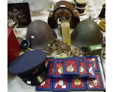 Boxes &amp; objects - an oak mantel clock, Arabic numerals; an RAF Service Dress cap; two military helmets; a H.Cheetham &amp