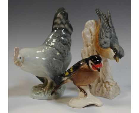 A Royal Copenhagen model cockerel, No. 107, printed and painted marks OHX; a Goebel model Nuthatch No. CV84/1967; another, Ch