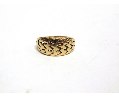 A LATE VICTORIAN RING with partial hallmarks, of plaited front design, 5g gross