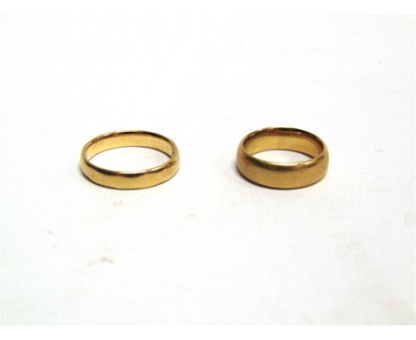 A 22 CARAT GOLD WEDDING RING and another 22 carat gold wedding ring; 11.4g gross