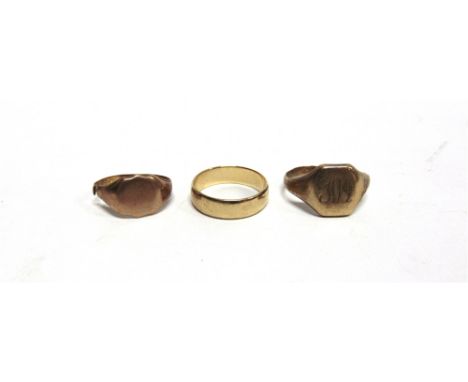 A 9 CARAT GOLD WEDDING RING and two 9 carat gold signet rings; 12.7g gross