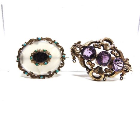 A VICTORIAN THREE STONE AMETHYST GOLD BROOCH  with a hollow scroll work frame, 5.5cm long, 14g gross; with a Victorian agate 