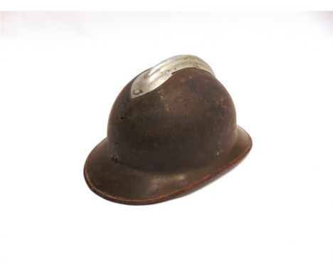 A FRENCH M26 ADRIAN HELMET  retaining much of its original khaki paint finish (lacking helmet plate, chinstrap and liner).