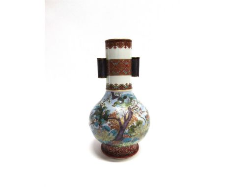 A LARGE ORIENTAL CERAMIC VASE  probably Japanese Meiji period, of spherical form with elongated neck applied with tube handle