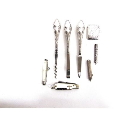 A SILVER VESTA CASE  Birmingham 1901; a fold out glove button hook; three silver handled manicure items; a multipurpose penkn