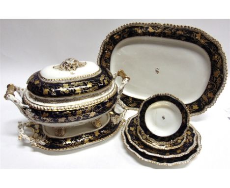 AN EXTENSIVE EARLY 19TH CENTURY HURCULANEUM POTTERY DINNER SERVICE  with gilt vine leaf decoration to the Royal blue borders 
