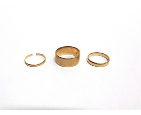 A 22 CARAT GOLD WEDDING RING with another; 4.8g gross; and an 18 carat gold wedding ring, 9.4g gross