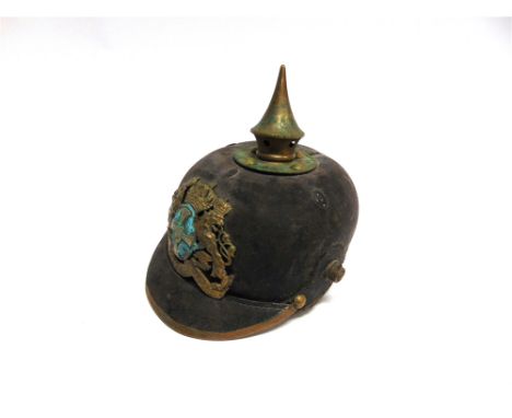 AN IMPERIAL GERMAN BAVARIAN RESERVE PICKELHAUBE  the leather shell complete with helmet plate and visor (lacking chinstrap, c