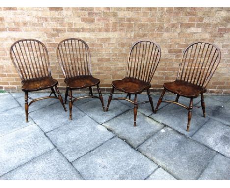 A SET OF FOUR STICK BACK WINDSOR DINING CHAIRS  on crinoline stretcher bases, 46.5cm wide 46cm deep, 100cm high overall